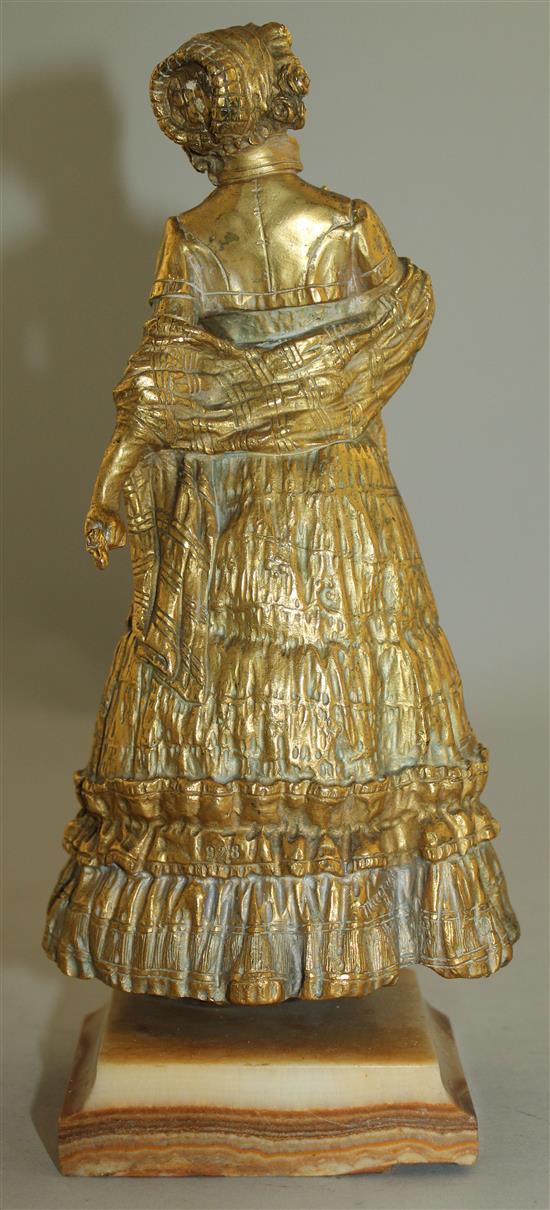 Rene Paul Marquet (French, 1879-1939). A gilt bronze and ivory figure of a lady wearing a bonnet, 10.25in.